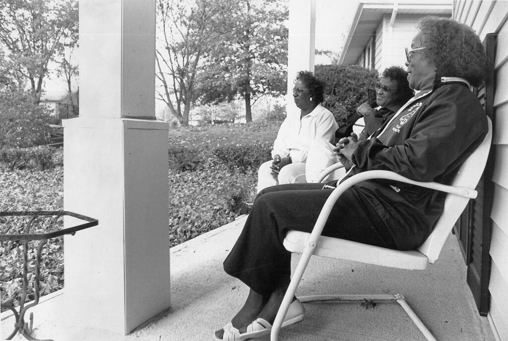 Mildred Brooks, Beth Nunnelly and Clara Miles talk on the porch